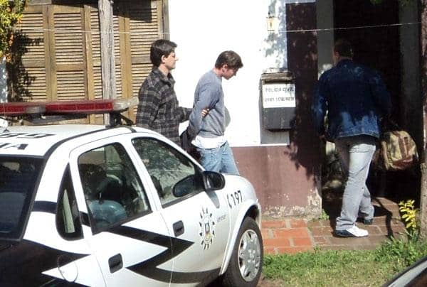Gilso Alan Altmann (C) foi condenado por homicídio triplamente qualificado